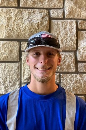 Headshot of a male wearing a hat