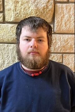 Headshot of male with facial hair