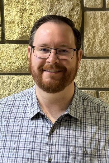 headshot of male with glasses
