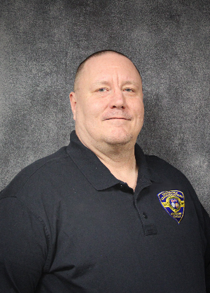 Headshot of male with light, short hair