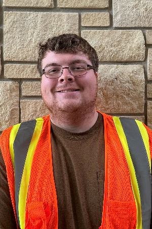 Headshot of male with light hair and glasses