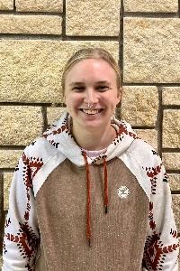 Headshot of a female with long light hair