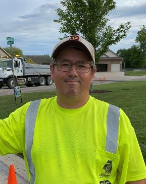 Collins, Richard - headshot of a male with a hat and glasses