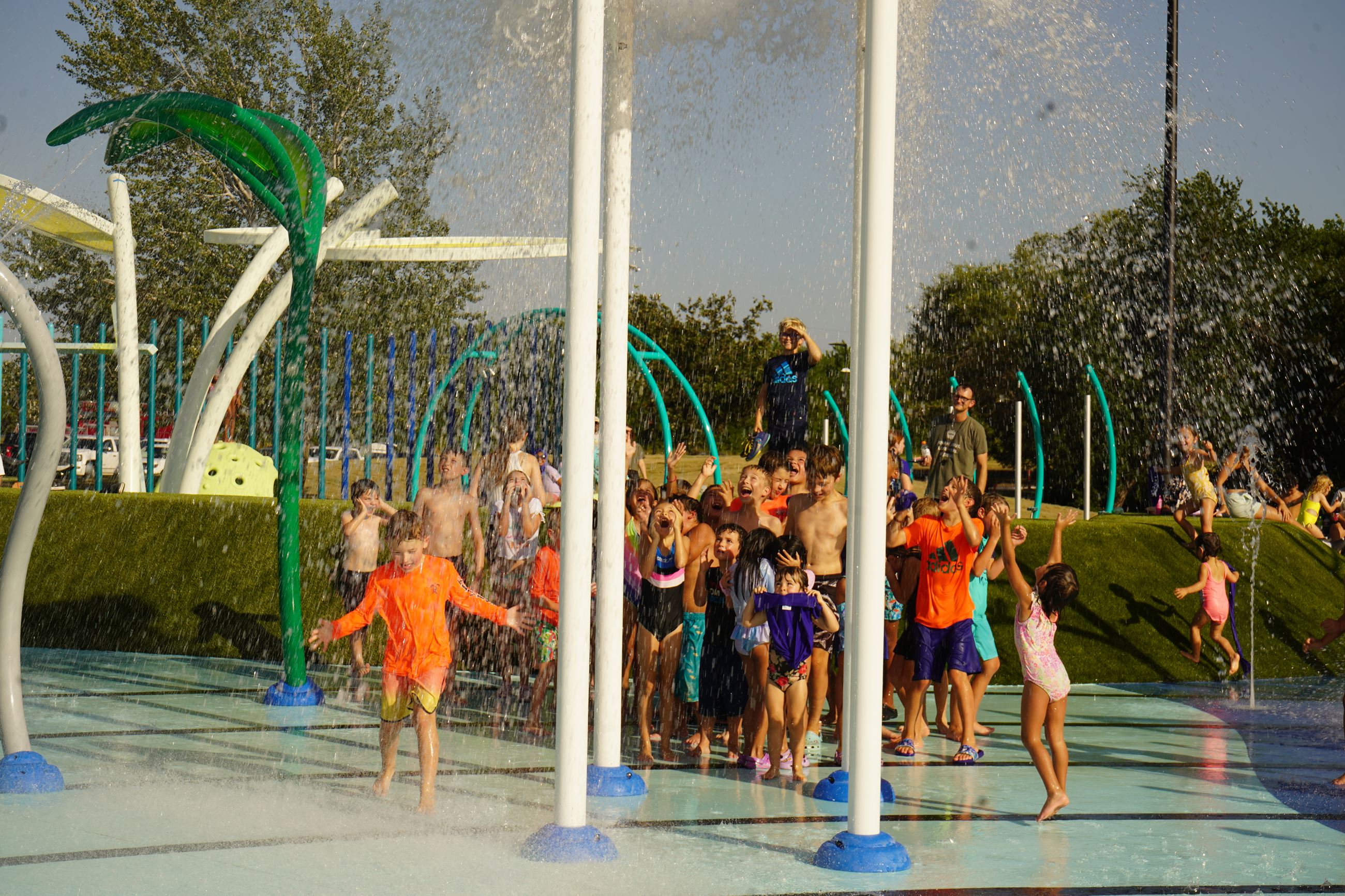 photo of children playing in splash pad at the park